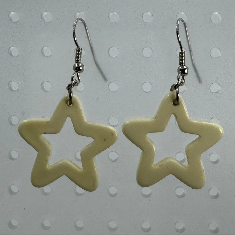 White Plastic Star Earrings With Red and Blue Rhinestones